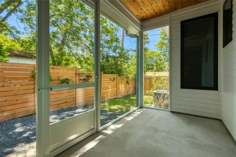 a view of backyard with large windows