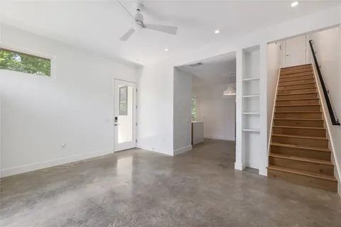 an empty room with a hallway and entryway
