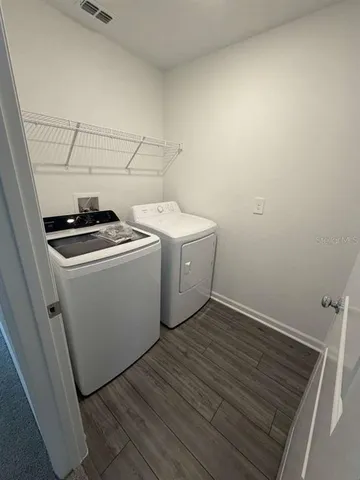 a utility room with dryer and washer
