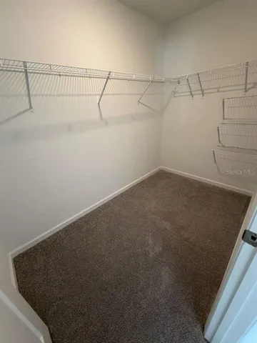 a view of a room with racks on the wall