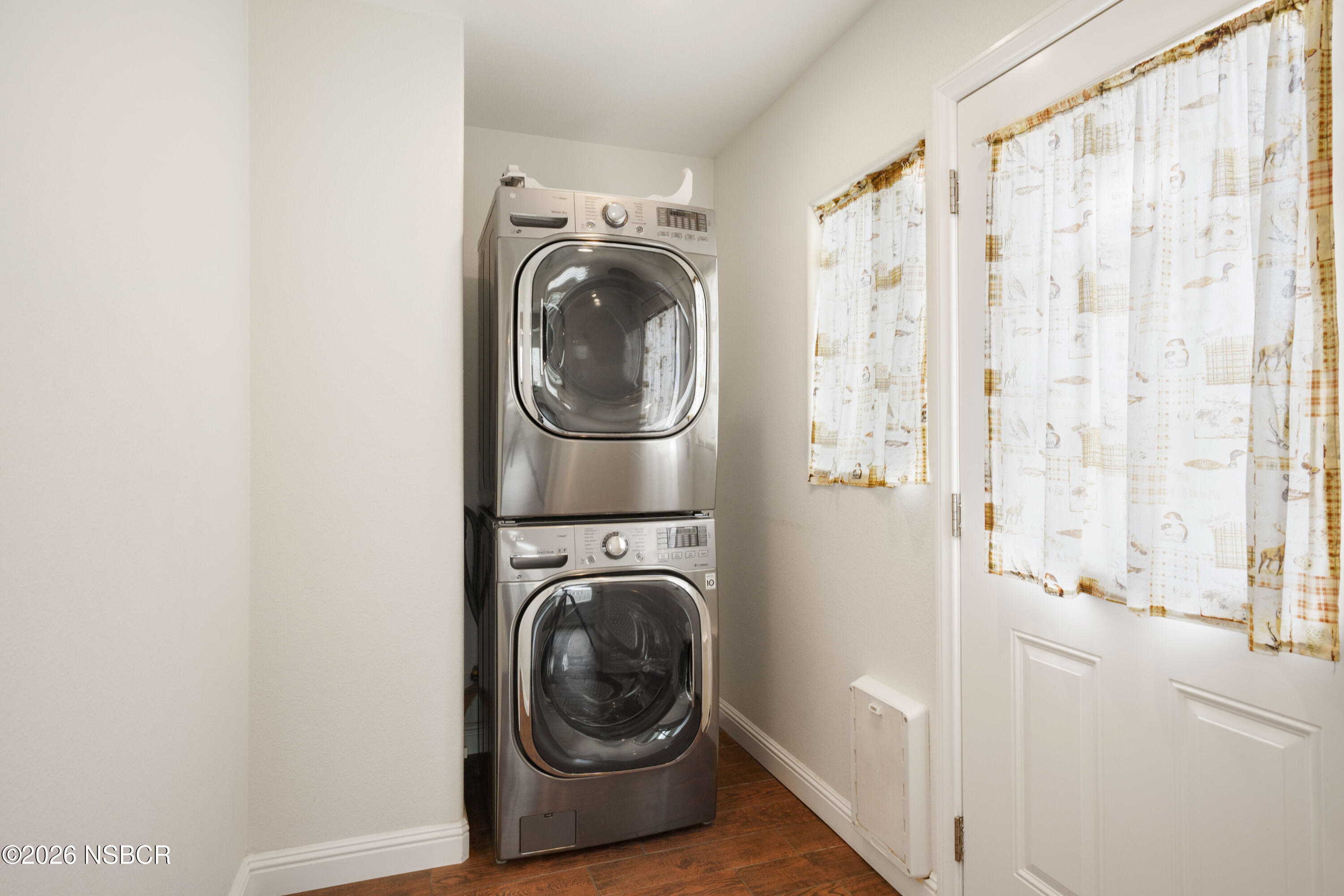 138 North E Street Lompoc, CA 93436 - Photo 15 of 35 a utility room with sink dryer and washer