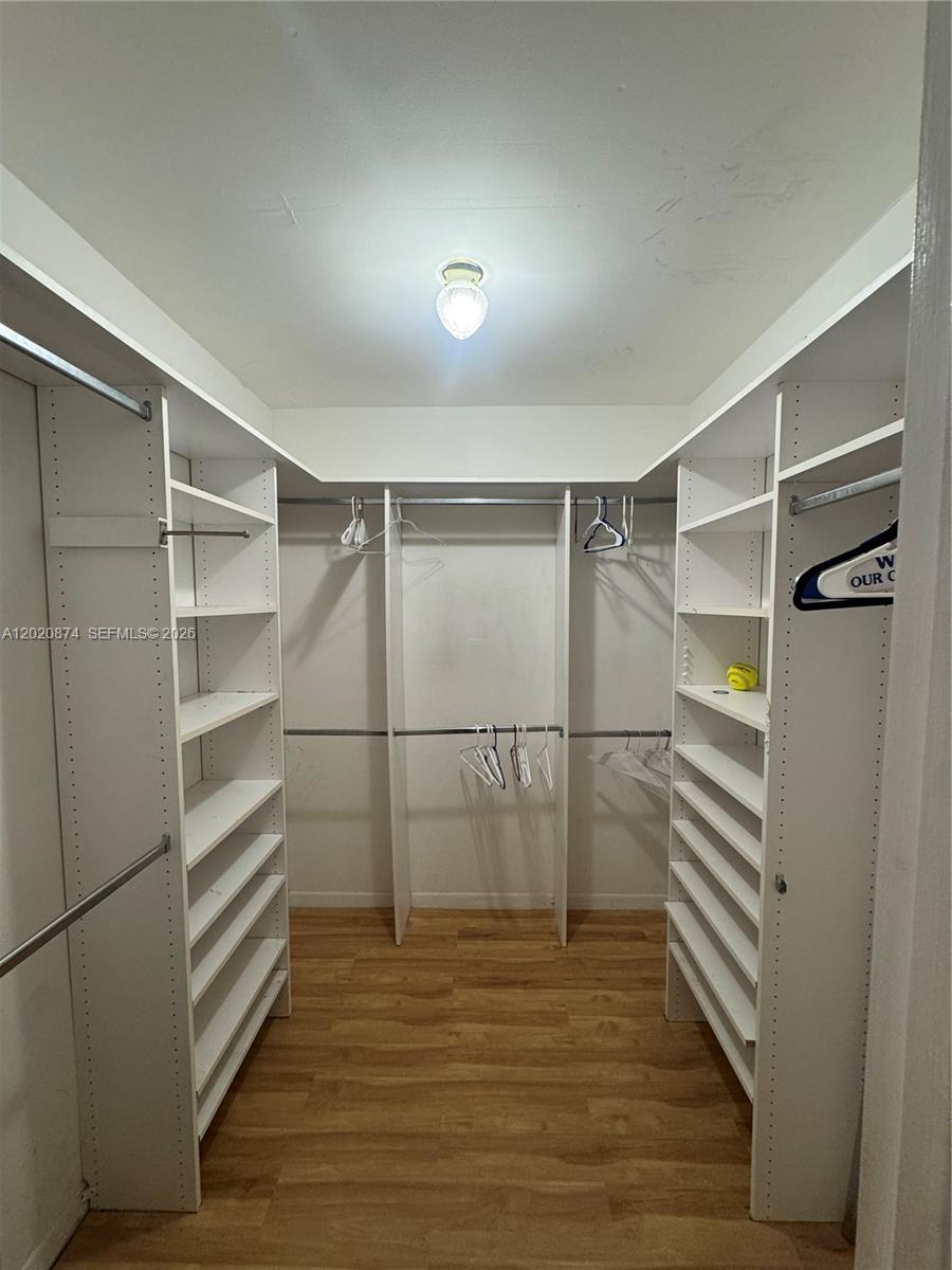 6731 Cypress Road, Unit 410 Plantation, FL 33317 - Photo 4 of 15 a view of walk in closet with empty racks