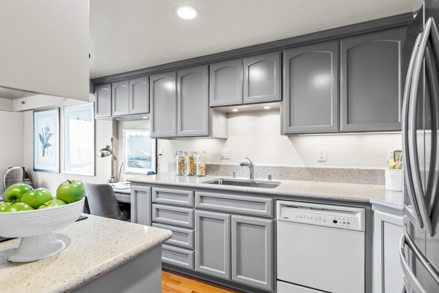 30 Mounds Road, Unit 305 San Mateo, CA 94402 - Photo 14 of 28 a kitchen with stainless steel appliances granite countertop a sink a stove and cabinets