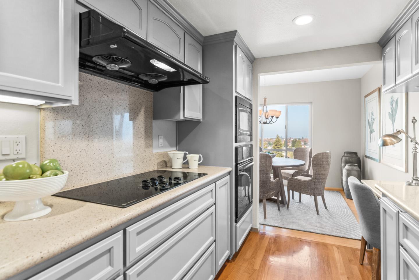 30 Mounds Road, Unit 305 San Mateo, CA 94402 - Photo 15 of 28 a kitchen with a table chairs stove and cabinets