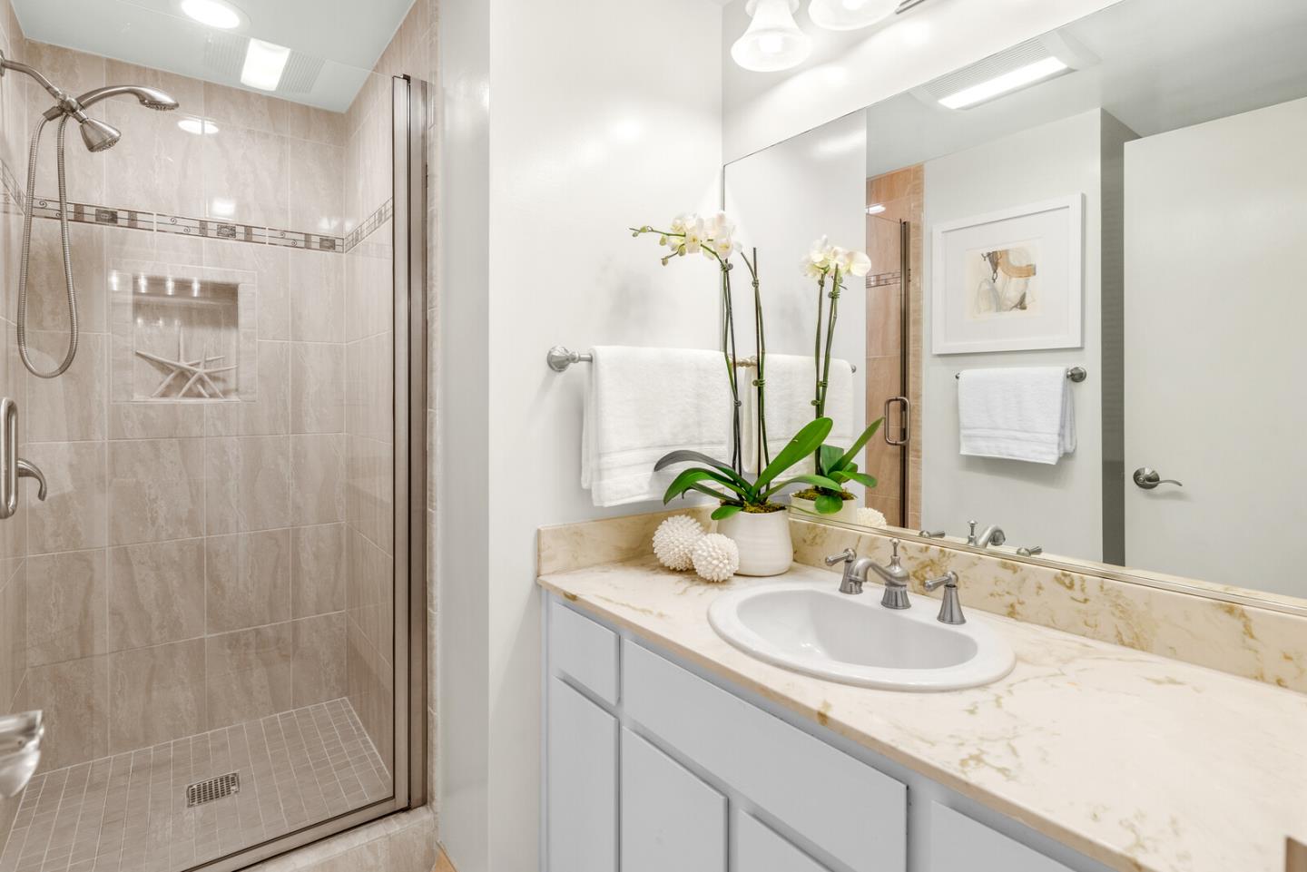 30 Mounds Road, Unit 305 San Mateo, CA 94402 - Photo 23 of 28 a bathroom with a granite countertop sink and a mirror
