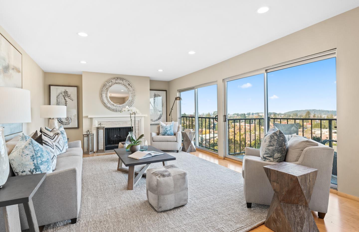 30 Mounds Road, Unit 305 San Mateo, CA 94402 - Photo 6 of 28 a living room with furniture a fireplace and a floor to ceiling window