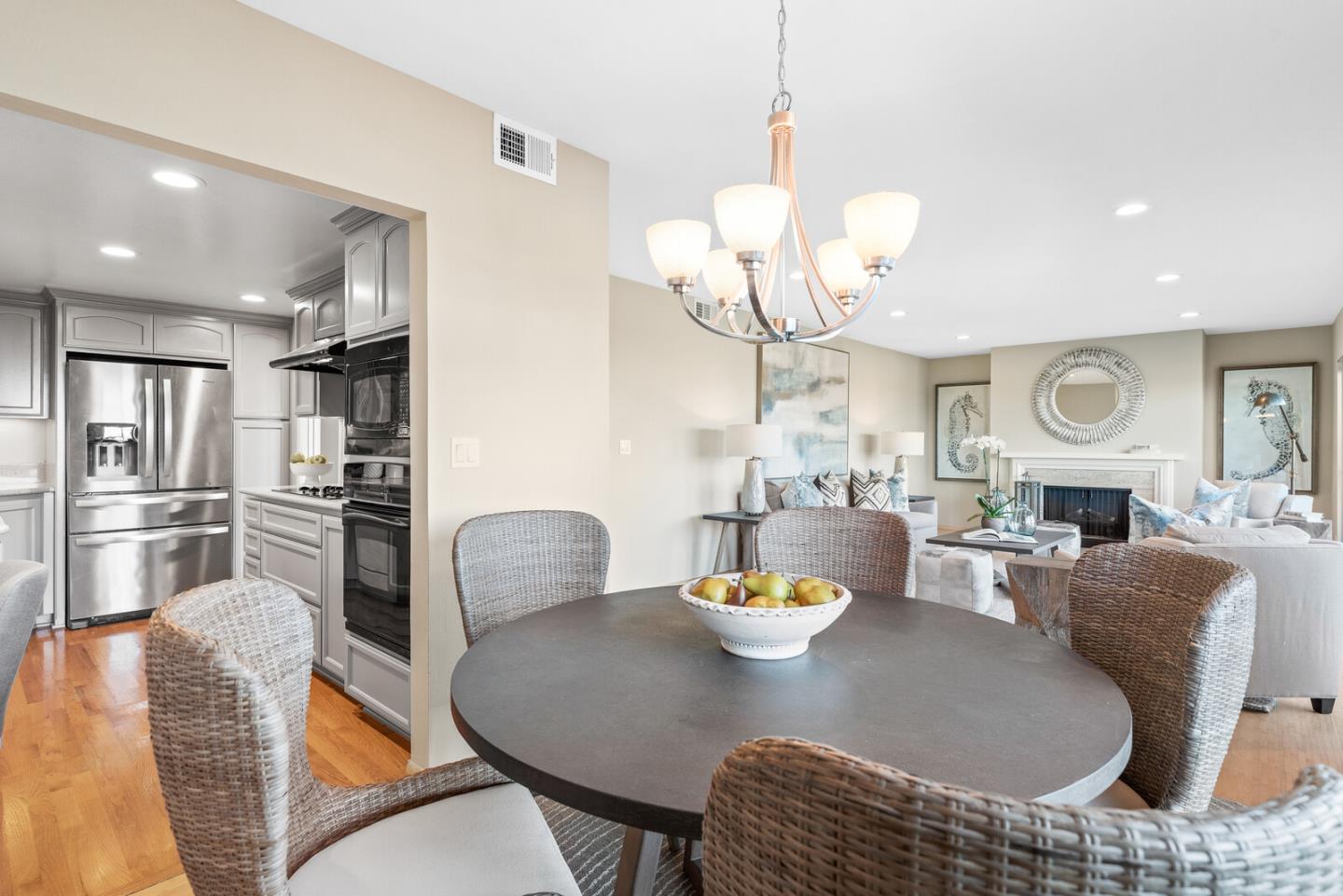 30 Mounds Road, Unit 305 San Mateo, CA 94402 - Photo 10 of 28 a view of a dining room with furniture a chandelier and wooden floor