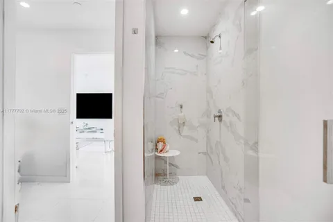 a bathroom with a shower toilet and a sink