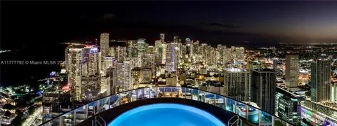 a view of a room with lots of wooden furniture