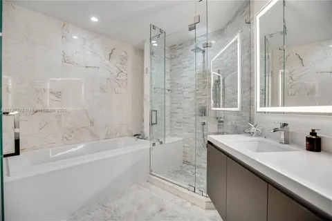a bathroom with a bathtub and a sink
