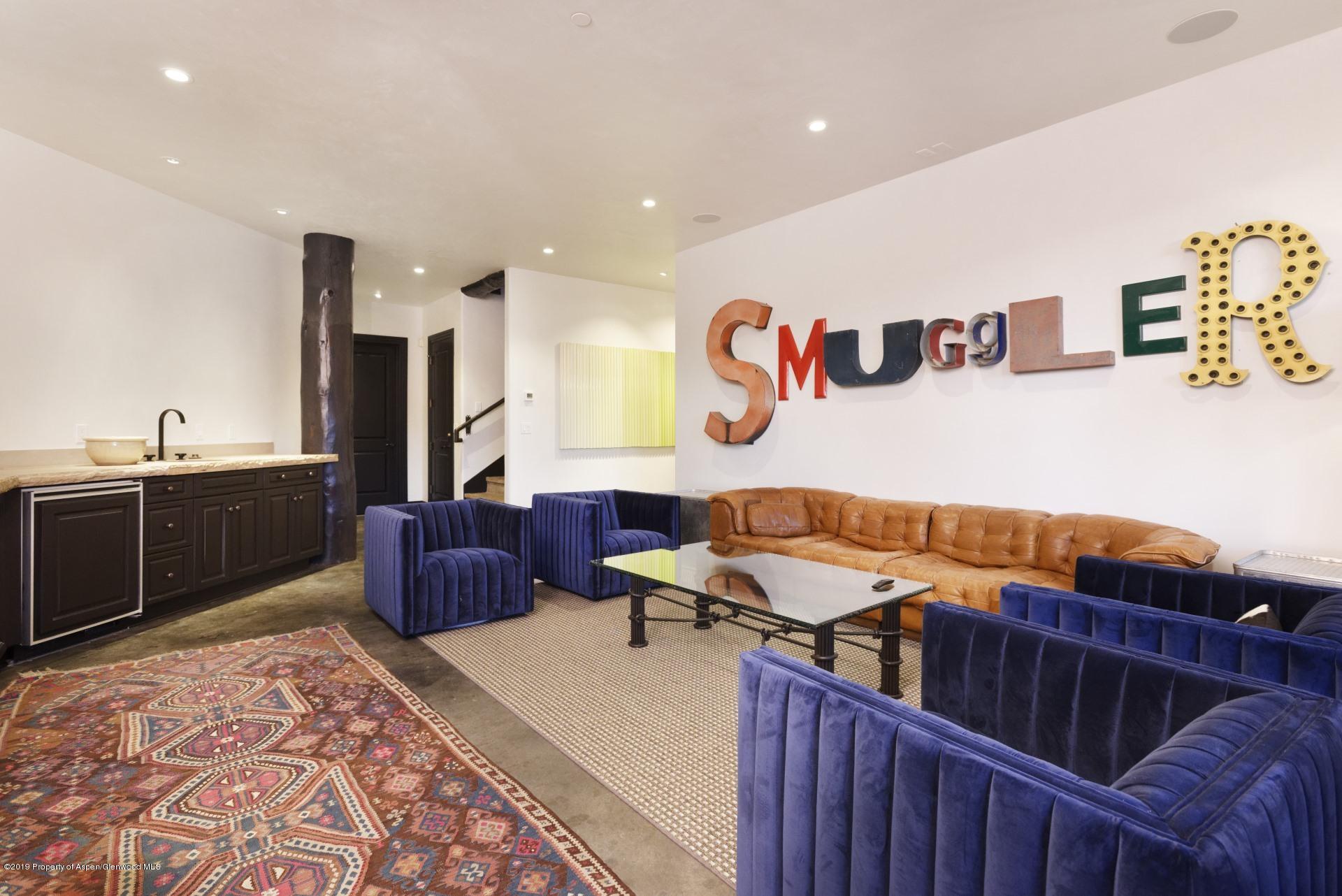 450 Smuggler Mountain Road Aspen, CO 81611 - Photo 15 of 37 a living room with stainless steel appliances kitchen island granite countertop a sink and a refrigerator