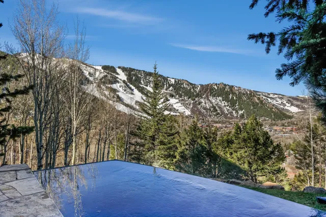 a view of a chairs and table in the patio