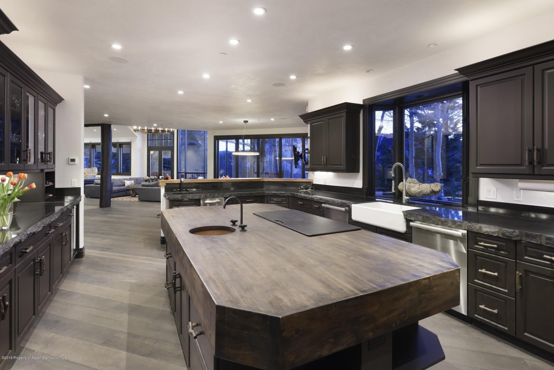 450 Smuggler Mountain Road Aspen, CO 81611 - Photo 8 of 37 a large kitchen with lots of counter space