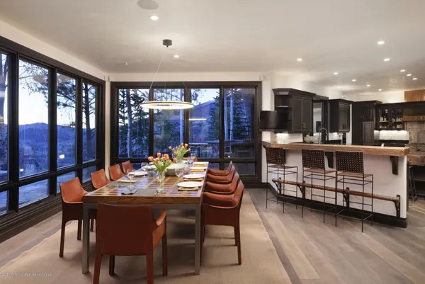 a dining room with furniture and chandelier