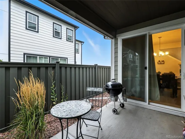 a view of a chairs and table in patio