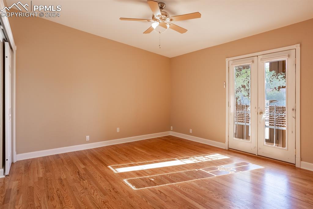 1074 Fontmore Road, Unit C Colorado Springs, CO 80904 - Photo 13 of 30 Primary bedroom with vaulted ceiling and French doors
