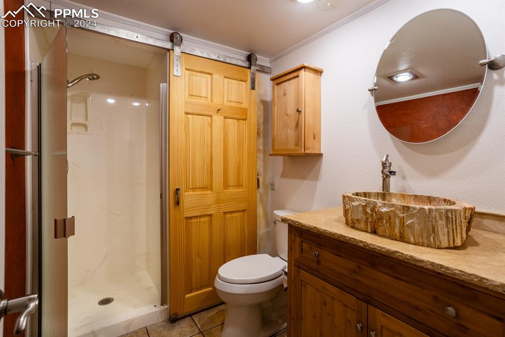 1074 Fontmore Road, Unit C Colorado Springs, CO 80904 - Photo 19 of 30 Guest bathroom with walk in shower