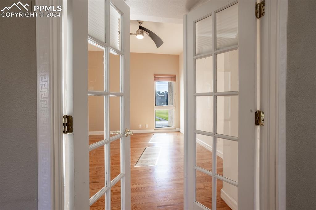 1074 Fontmore Road, Unit C Colorado Springs, CO 80904 - Photo 20 of 30 Third bedroom, could be study/office with wood-type flooring and French doors