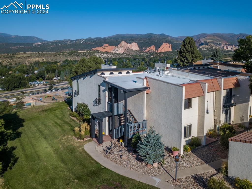 1074 Fontmore Road, Unit C Colorado Springs, CO 80904 - Photo 27 of 30 Side view of structure with Garden of the Gods in the background