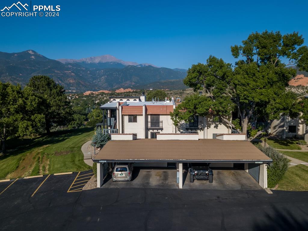 1074 Fontmore Road, Unit C Colorado Springs, CO 80904 - Photo 28 of 30 Front view with carport and Pikes Peak in the background