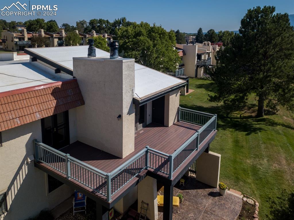 1074 Fontmore Road, Unit C Colorado Springs, CO 80904 - Photo 3 of 30 Rear view of property featuring a deck and a yard