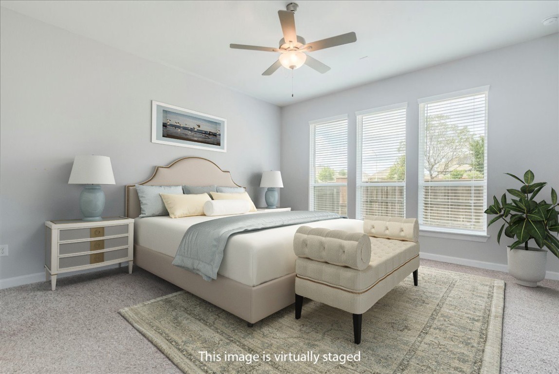 584 Baretta Loop Buda, TX 78610 - Photo 14 of 37 Virtually staged primary bedroom