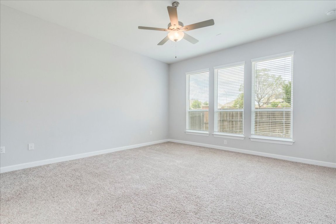 584 Baretta Loop Buda, TX 78610 - Photo 15 of 37 Large primary bedroom on 1st floor