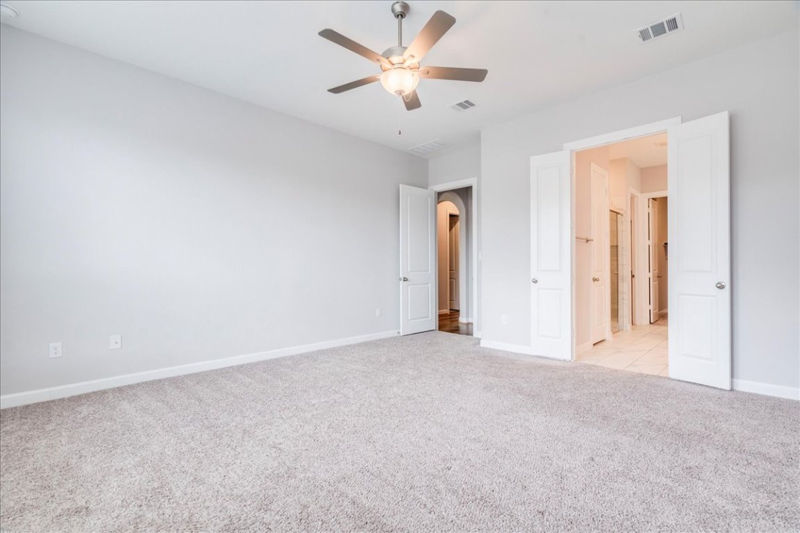 584 Baretta Loop Buda, TX 78610 - Photo 16 of 37 Large primary bedroom on 1st floor