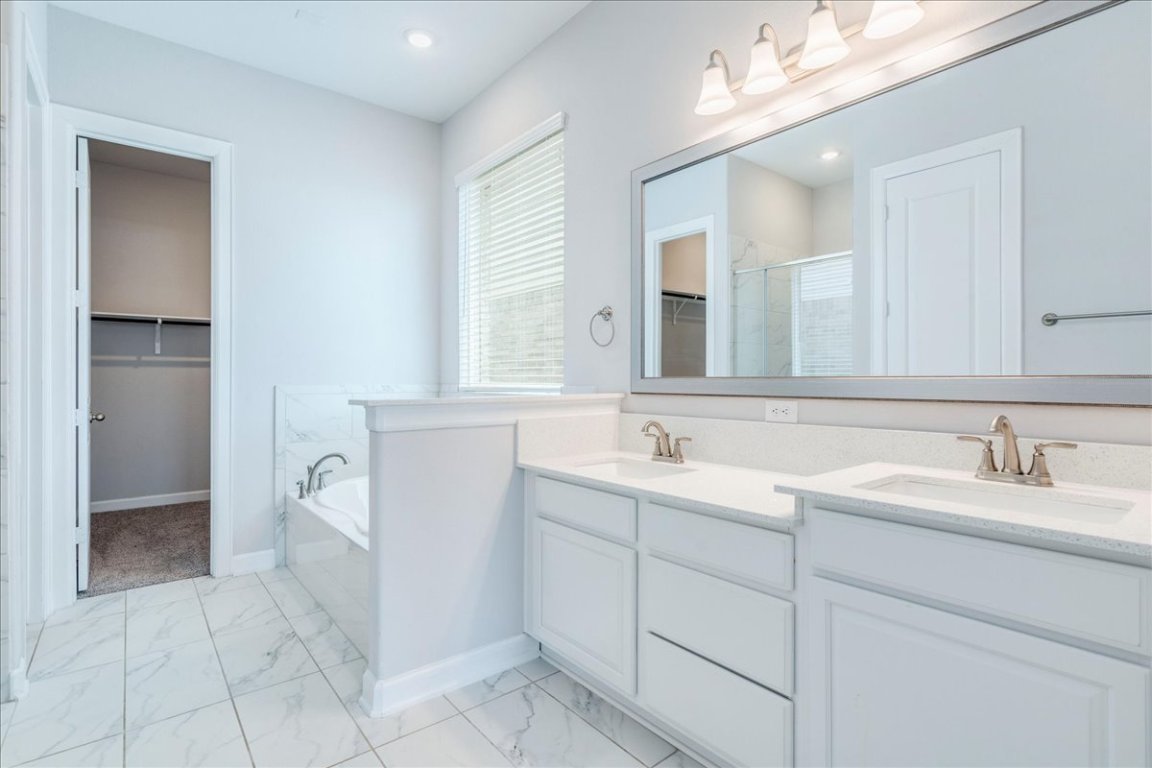 584 Baretta Loop Buda, TX 78610 - Photo 17 of 37 Double sinks, separate garden tub