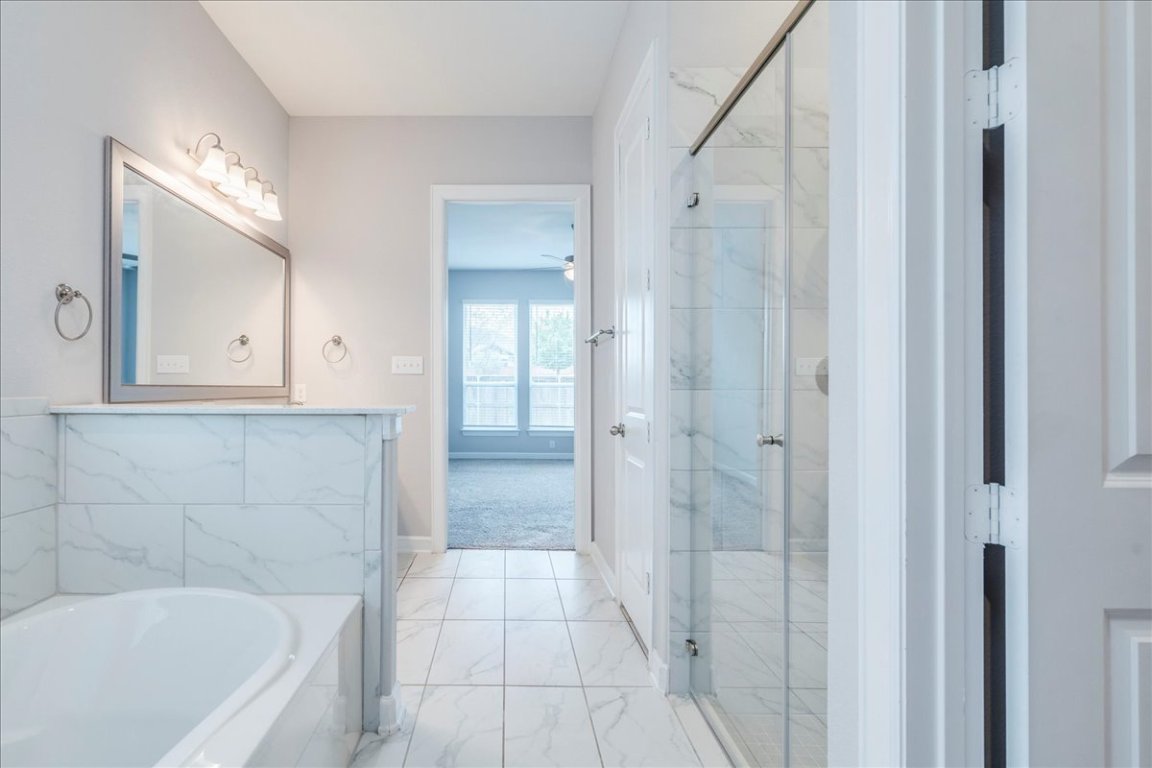 584 Baretta Loop Buda, TX 78610 - Photo 18 of 37 Garden tub, walk in shower