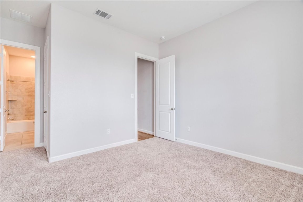 584 Baretta Loop Buda, TX 78610 - Photo 20 of 37 Additional bedroom on 1st floor with ensuite bathroom