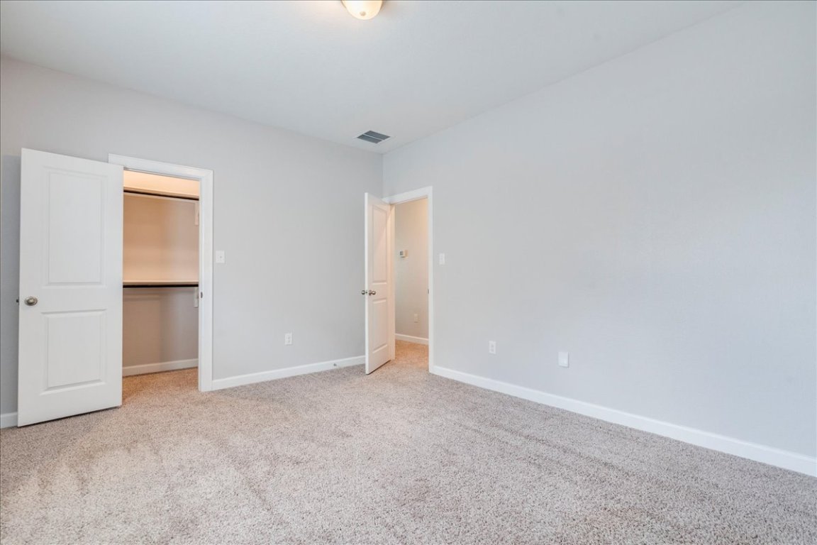 584 Baretta Loop Buda, TX 78610 - Photo 25 of 37 Spacious upstairs bedroom with walk-in closet