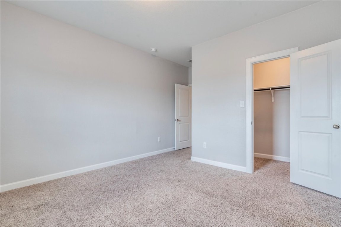 584 Baretta Loop Buda, TX 78610 - Photo 27 of 37 Spacious upstairs bedroom with walk-in closet