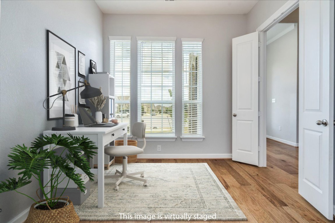 584 Baretta Loop Buda, TX 78610 - Photo 7 of 37 Home office with light wood-style floors and baseboards