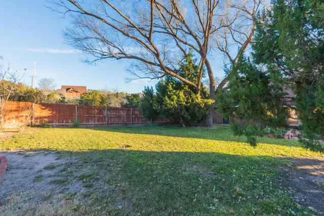 a view of a swimming pool with an outdoor space and a swimming pool