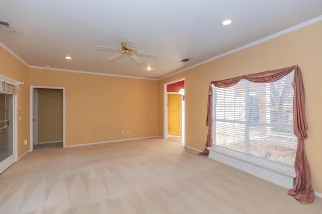 a view of an empty room with a window