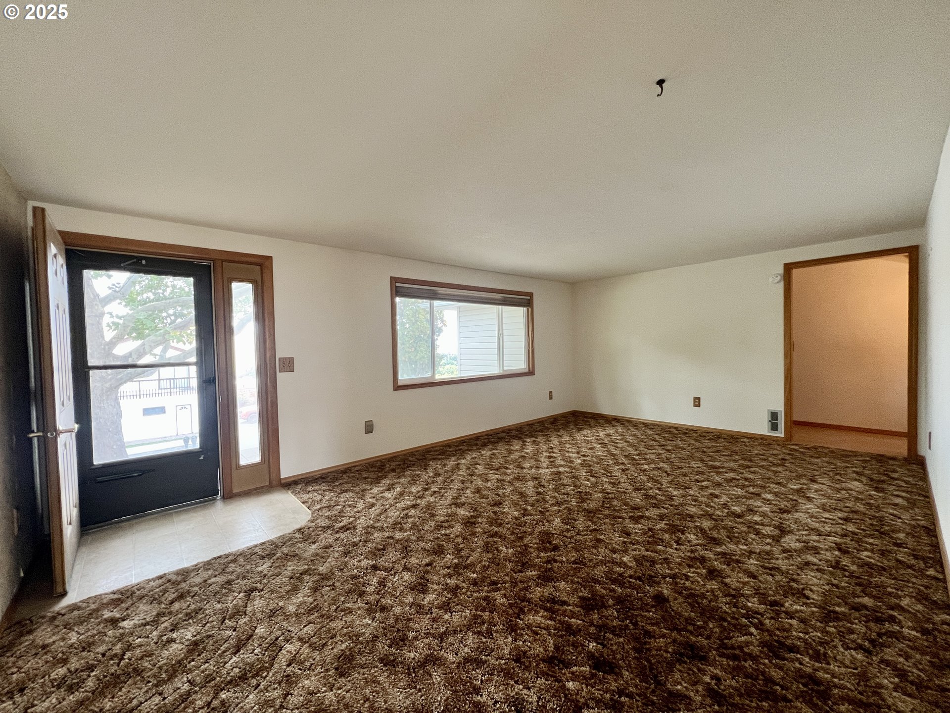 185 Rock Street Heppner, OR 97836 - Photo 11 of 25 a view of an empty room and window
