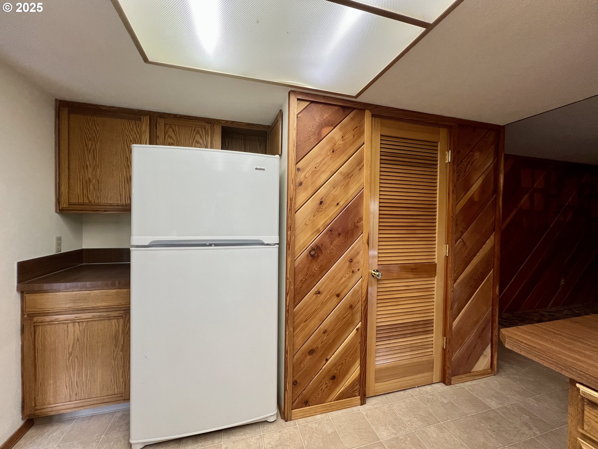 185 Rock Street Heppner, OR 97836 - Photo 15 of 25 a view of storage and utility room with refrigerator and cabinet