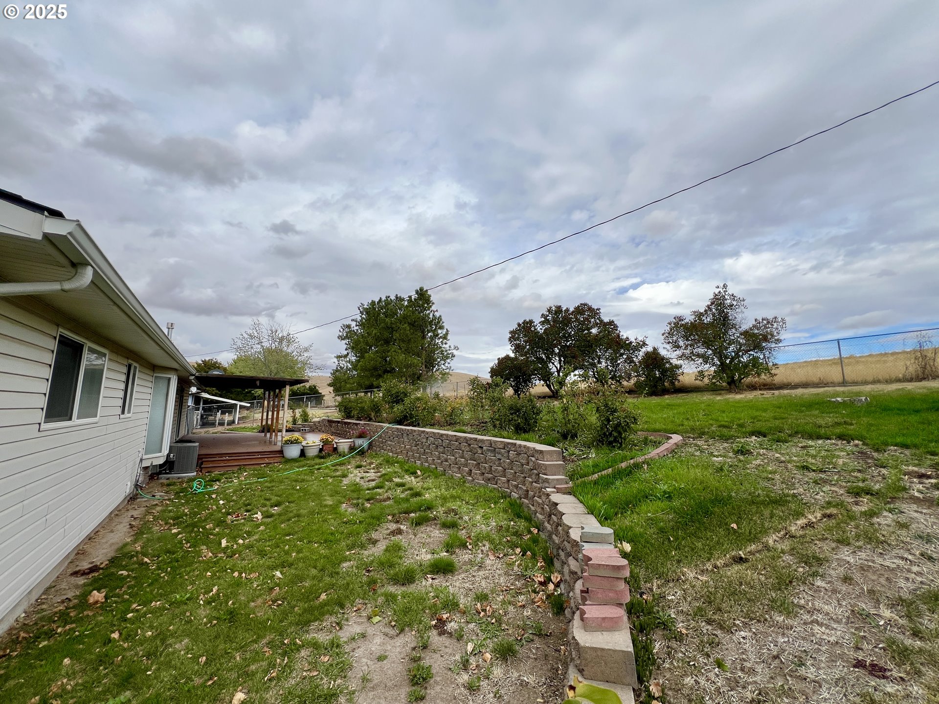 185 Rock Street Heppner, OR 97836 - Photo 8 of 25 a view of a house with a big yard