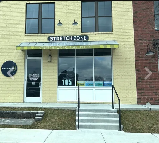 a front view of a building with garden