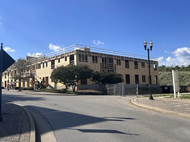 a view of a building and a street