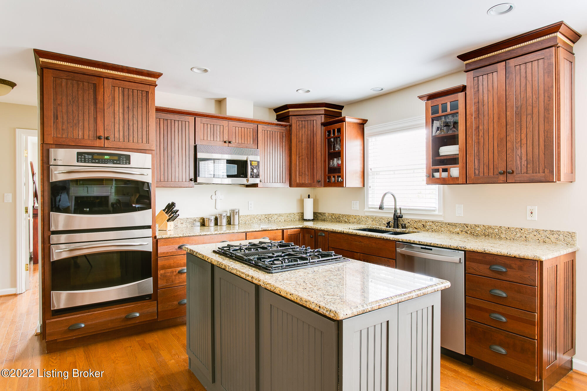 219 Sequoya Road Louisville, KY 40207 - Photo 12 of 59 Remodeled kitchen with granite counters, center island, downdraft gas cooktop, double ovens and Advantium oven/microwave, and dishwasher. Plentiful cabinetry.