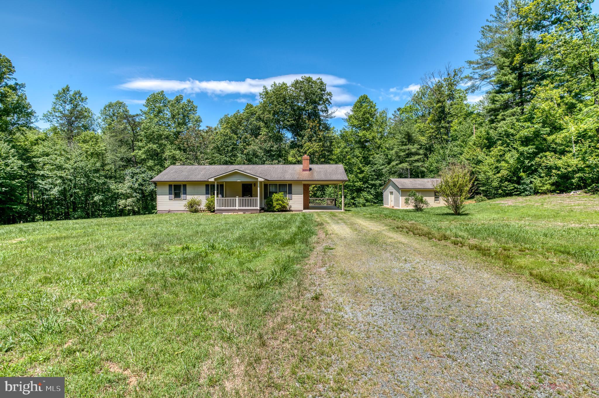 803 Weaver Hollow Road Banco, VA 22711 - Photo 30 of 67 a front view of a house with garden