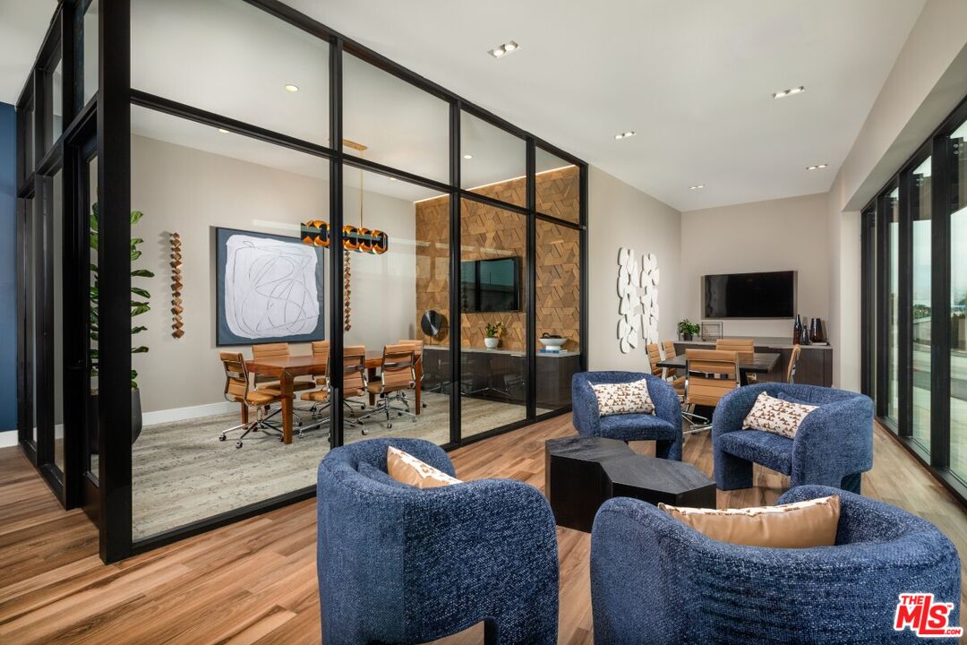 201 North La Brea Avenue, Unit 403 Inglewood, CA 90301 - Photo 5 of 19 a living room with furniture and a flat screen tv