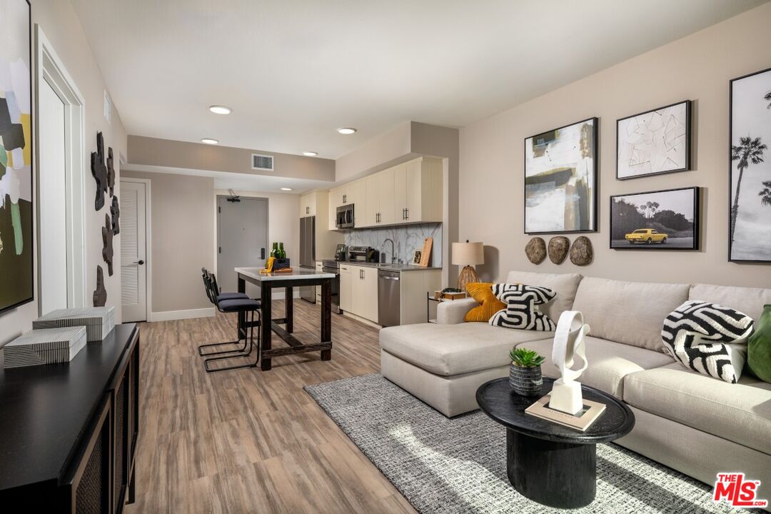 201 North La Brea Avenue, Unit 403 Inglewood, CA 90301 - Photo 8 of 19 a living room with furniture and a large window