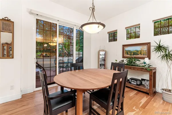 a view of a dining room with furniture window and wooden floor