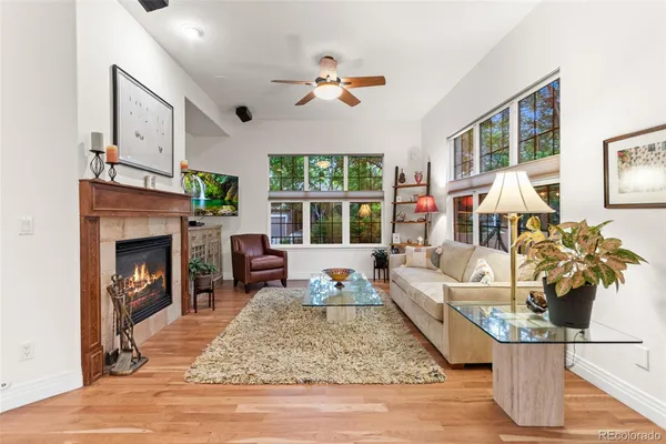 a living room with furniture fireplace and window