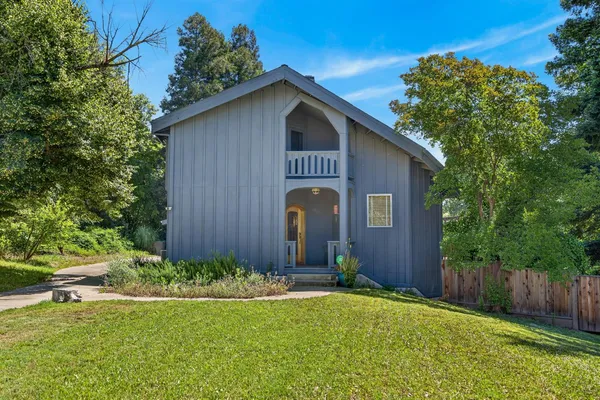 a front view of a house with garden