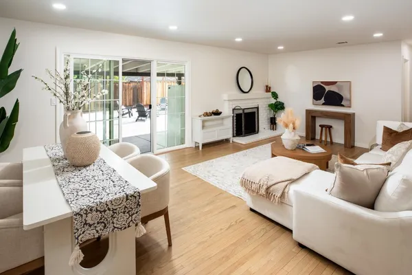 a living room with furniture fireplace and flat screen tv