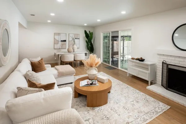 a living room with furniture and a fireplace